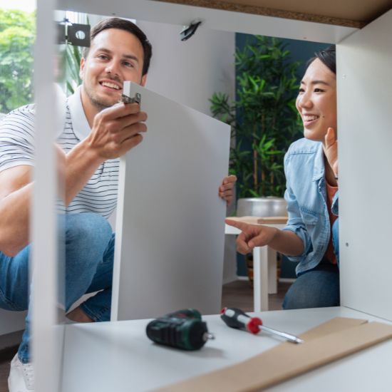 Couple Fixing Cabinets
