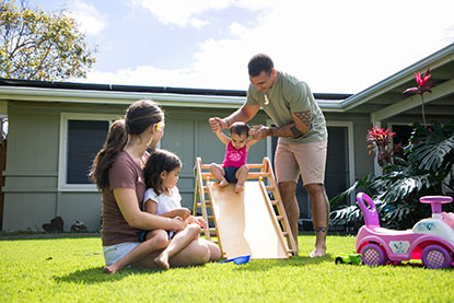 Family in front of home