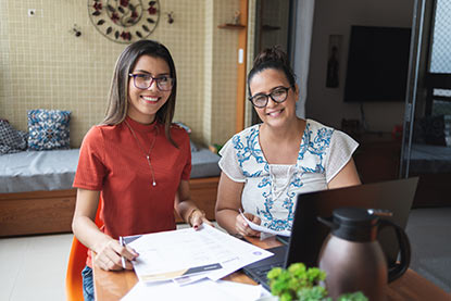 Mother and college student on laptop