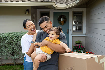 Family in front of home