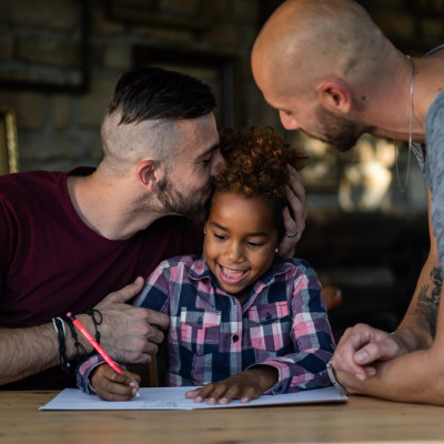 dads with child doing homework