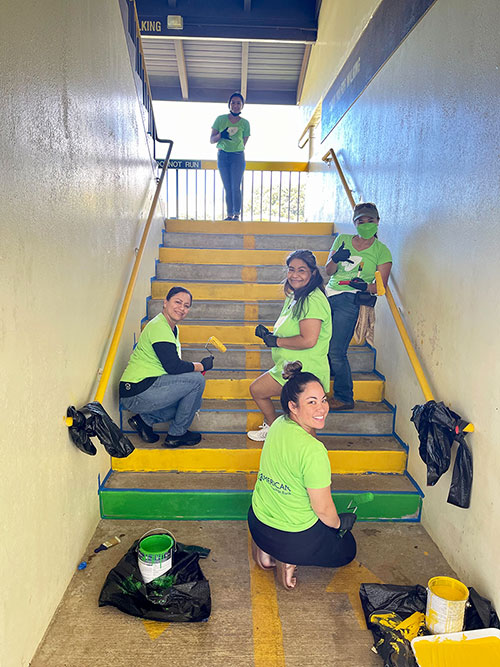 ASB teammates painting a staircase