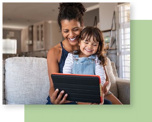 mom and daughter with device