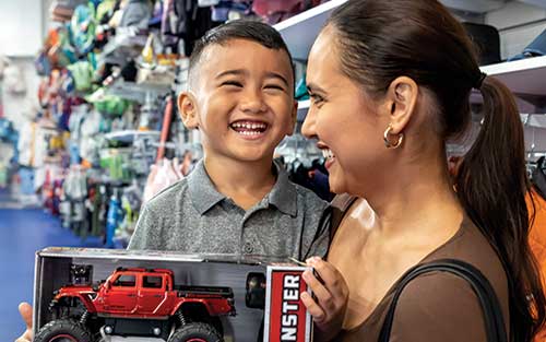 Mother and son in toy store
