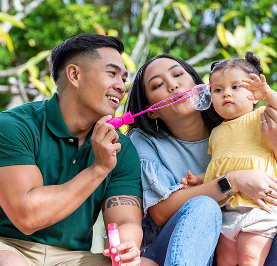 Family blowing bubbles