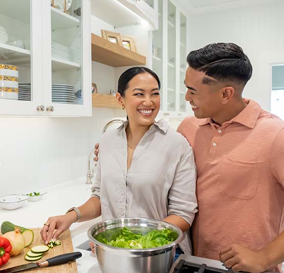 Couple preparing dinner in new home