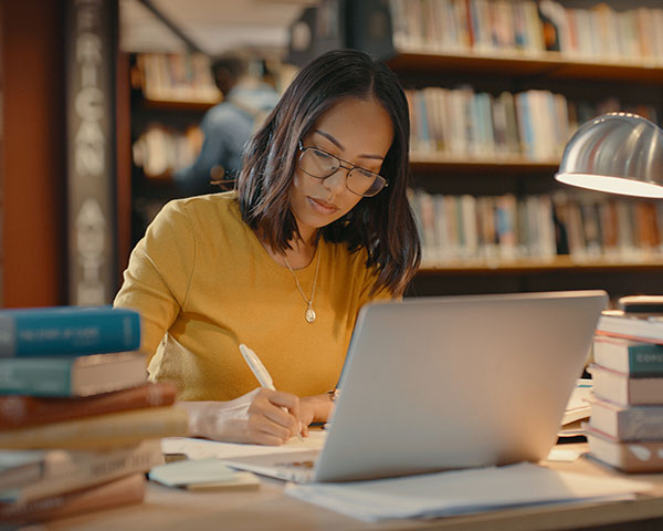 Student on laptop in library