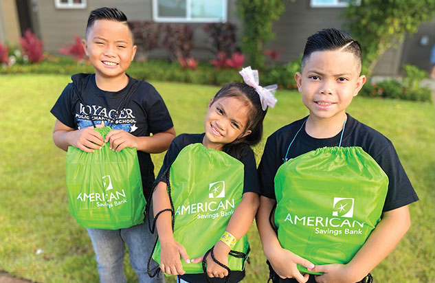 Kids receving school supplies