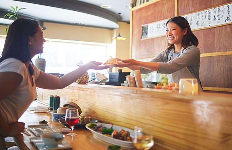 business owner serving coffee