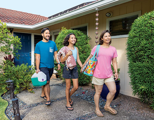 Family outside of Hawaii home