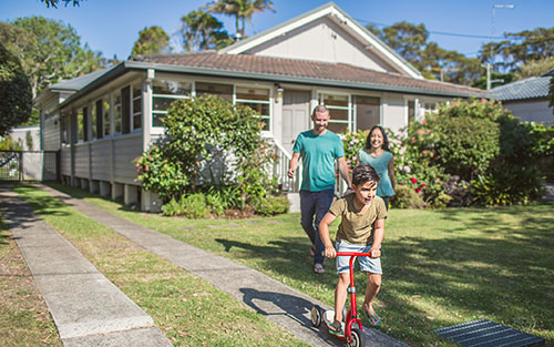 Family infront of house