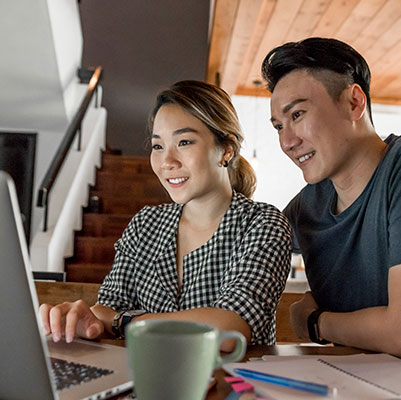 Couple using laptop