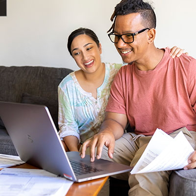 Couple using laptop
