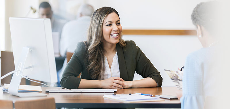 Mortgage loan officer talking to customer