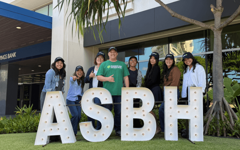 ASB teammates with ASBH Letters infront of ASB Campus