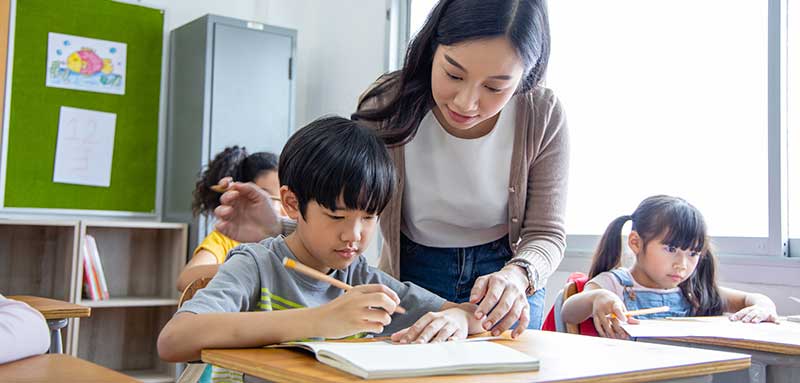 teacher helping student