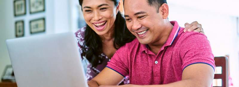 husband and wife on computer