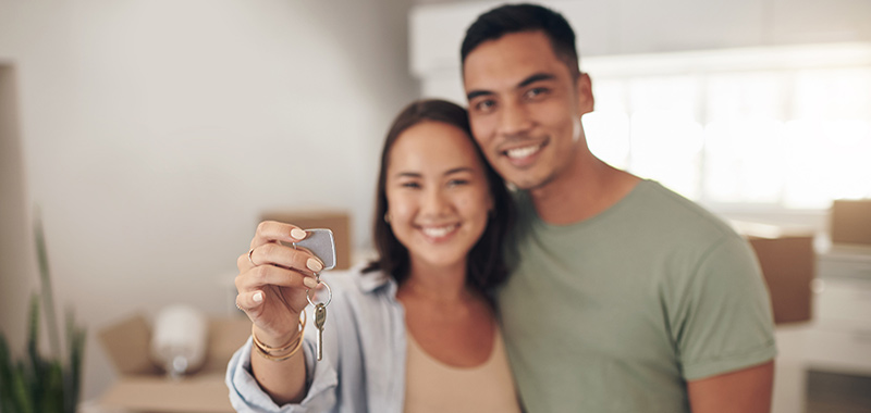 Couple holding house keys