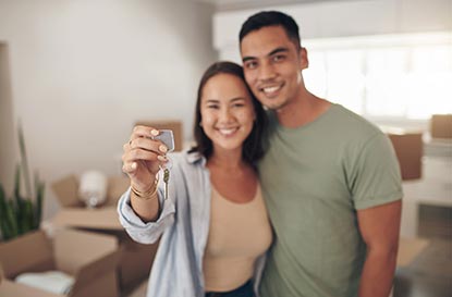 Couple holding house keys